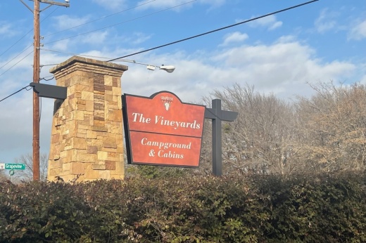Image of The Vineyards Campground and Cabins sign.