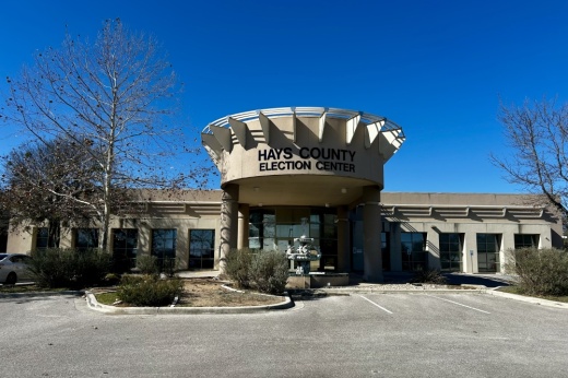 An exterior shot of a building that says Hays County Elections Office.