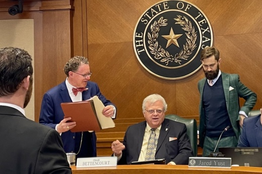 Sen. Paul Bettencourt, R-Houston, speaks with his staff following a Feb. 11 meeting of the Texas Senate Local Government Committee.
