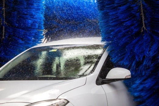 a car going through a brushed automatic washing machine