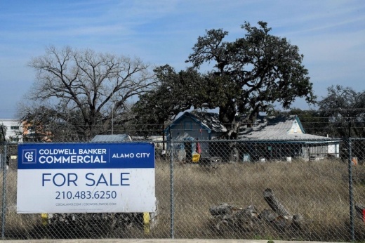 Land with a for sale sign