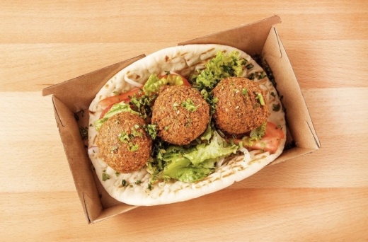 three pieces of falafel in pita bread