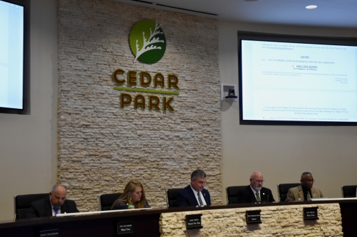 City council members at a meeting.