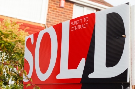 A home sold sign in front of residence