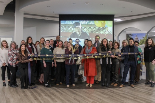 AGE of Central Texas staff and members from the Austin Chamber of Commerce celebrated the opening of the South Austin Thrive Social and Wellness Center with a ribbon-cutting Feb. 19. (Elisabeth Jimenez/Community Impact)