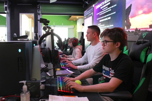 Students and teacher play esports at NextGen Academy