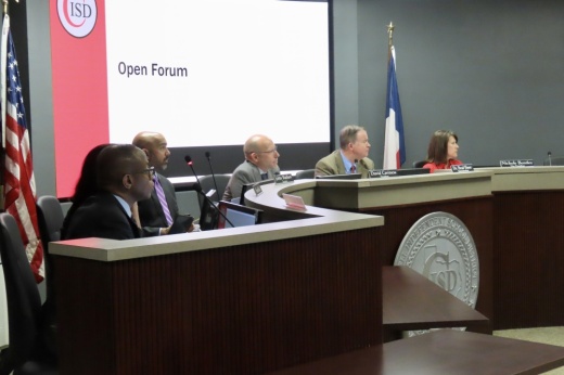 Coppell ISD trustees discuss agenda items at a board meeting.