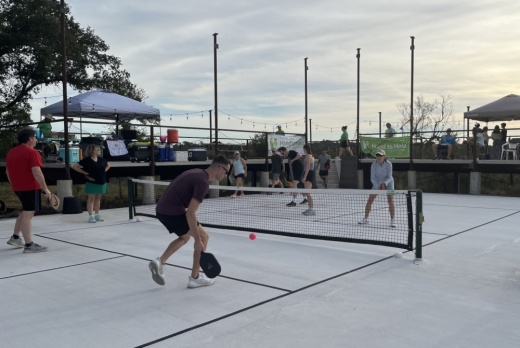2 people playing pickleball