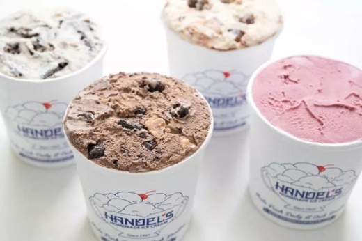 Four bowls of various flavors of ice cream.