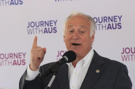 Austin Mayor Kirk Watson proclaims recent airport expansion projects will make Austin an international playing field. (Haley McLeod/Community Impact)