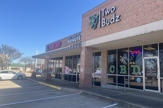 The storefront for Two Budz CBD shop on a sunny day.