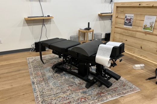 A massage chair is ready for a patient.