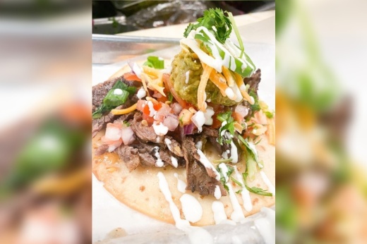 A specialty taco from The Dream Tacos, which serves several different taco options based on a variety of cuisines.