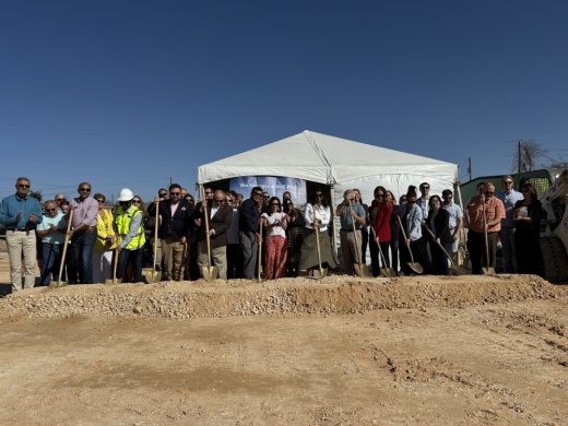 People holding shovels at a ribbon cutting ceremony