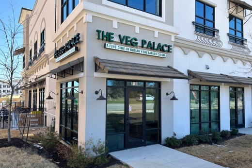 Exterior of building with The Veg Palace signage.