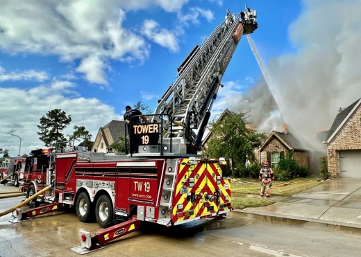 Firefighters with the Atascocita Fire Department work to put out a house fire in the Lake Houston area. AFD is one of three local fire departments that recently completed a station rebuild. (Courtesy Atascocita Fire Department)