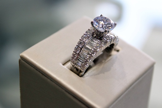 Close up photo of a diamond ring in a display box.
