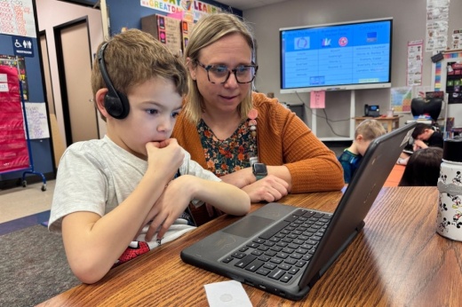 Meghan Cooney, a kindergarten teacher at Decker Prairie Elementary, assists a student on a computer. An $18 million bond proposition would upgrade technology, devices and Chromebooks. (Courtesy Tomball ISD)
