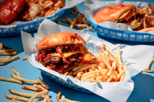 The "No Finer Diner" cheeseburger ($12.99) features two patties, cheese, caramelized onions and Buttermilk Baby sauce on a potato bun. (Courtesy Brian Kennedy)