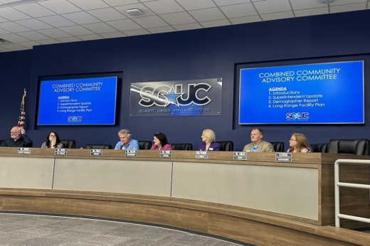 A school board sits at a dais in Schertz, Texas.