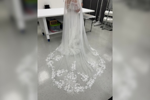 An image of a wedding dress altered at the business.