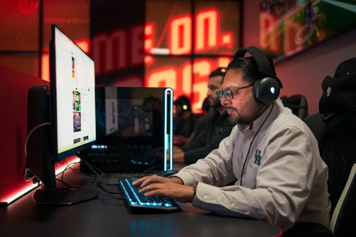 Telecommunications analyst Zee Ali showcases the University of Houston at Sugar Land’s esports room, launched in January. Esports is part of the college’s technology department, which will complete its transition to the Sugar Land campus this fall. (Ken Conkle/Community Impact)