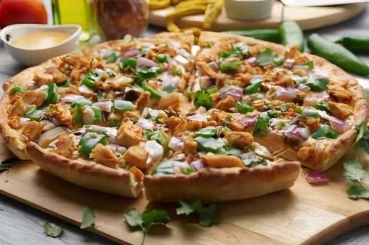 The Lahori Tikka pizza has the restaurant's signature butter sauce, mozzarella cheese, spiced chicken, mushrooms, red onion, bell peppers, garlic, ginger and green chiles. (Courtesy Pizza Twist)