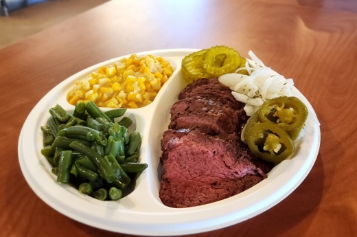 One popular menu item is a plate with a choice of meat and two sides. (Jarrett Whitener/Community Impact)