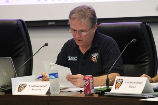 Harris County ESD No. 9 Commissioner Kevin Stertzel reviews a document at the April 24 meeting.
