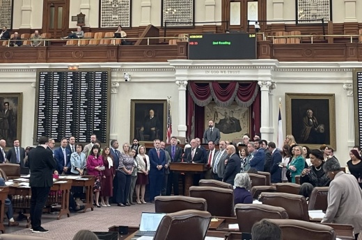 Lawmakers flank Rep. Don McLaughlin, R-Uvalde, as he outlines House Bill 33 on the Texas House floor April 28.