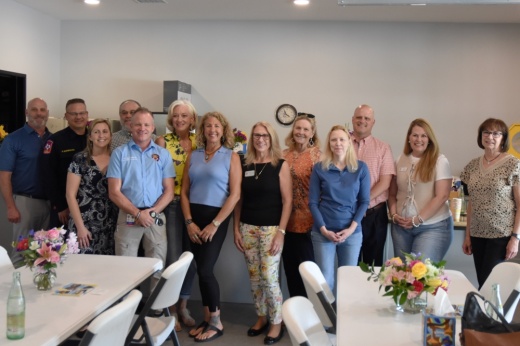 A group of people pose for a picture together.