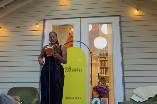 A photo of an author speaking at Kindred Stories