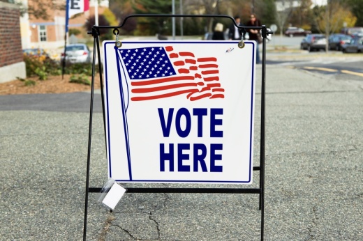 a Vote Here sign at a polling location