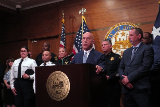 man speaking at podium