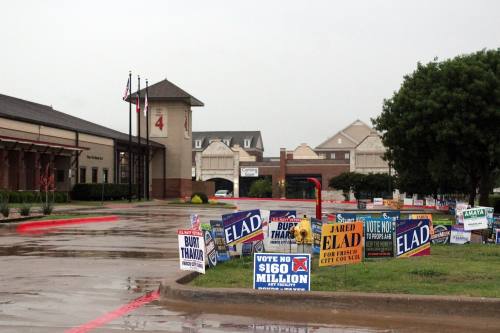 a polling location with several signs