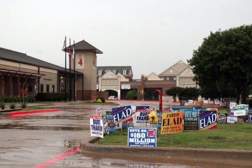 a polling location with several signs