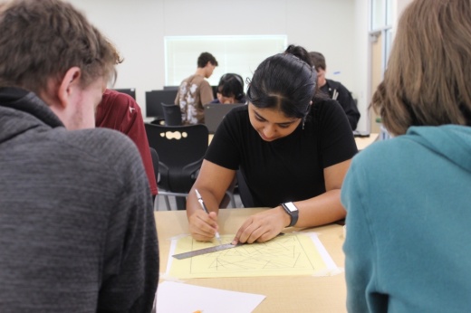 a group of students work on an assignment