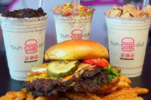 BunSlut burgers are prepared with cheese, grilled onions, pickles and the concept's signature sauce. (Courtesy BunSlut)