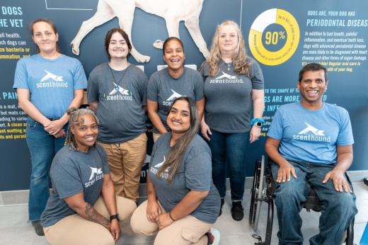 Scenthound franchisee Sachin Anantha (right) gathers with his staff in the lobby of the business on April 18 during the grand opening event. (Courtesy Scenthound)