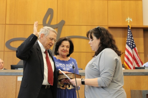 Newly elected District 3 council member Ben Butler was accompanied by his wife during his swearing in ceremony May 13. City Secretary Robyn Densmore swore him into office.