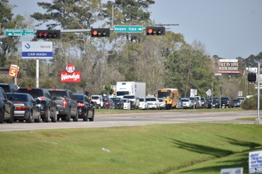 traffic lines Hwy. 242 at the intersection of Harpers Trace Blvd.