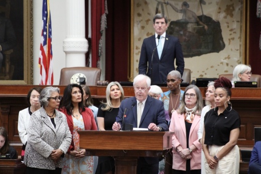 Women in the Texas House flank Rep. Charlie Geren on May 21.