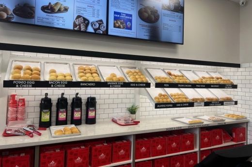 Shelves of kolaches and coffee dispensers