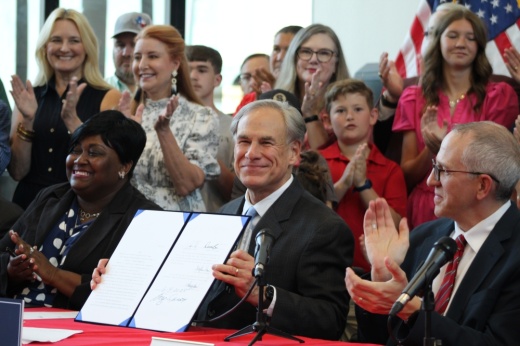 Gov. Greg Abbott smiles after signing House Bill 2 in Salado.