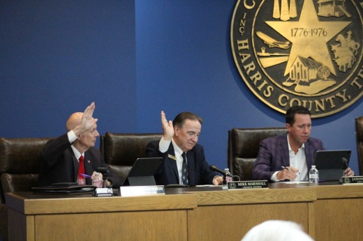 Mayor Pro Tem Bruce Davidson, left, and council member Mike Marshall, center, raising hands during a vote during the May 8 City Council meeting. Also pictured is and City Manager Jason Stuebe, right.