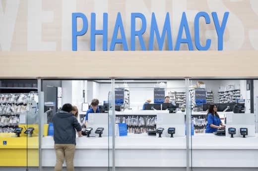 A customer checks out at a Walmart pharmacy.