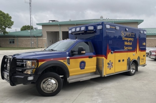 A picture of a blue and yellow ambulance is shown in the city of Schertz, Texas.