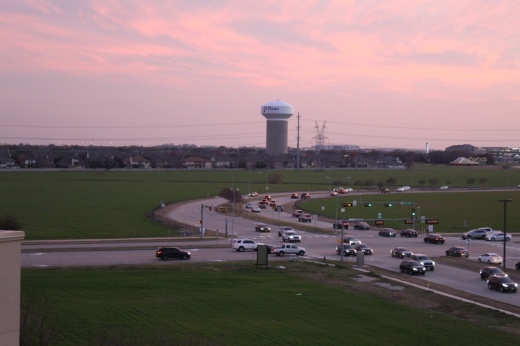 cars driving on road near haggard farms