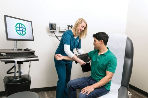 Breeze Urgent Care staff taking a patient's blood pressure