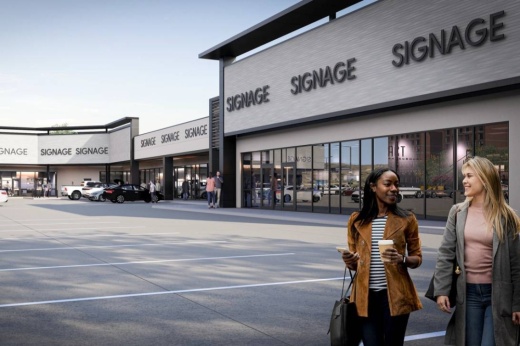 Rendering of a shopping center with two females walking away from it.